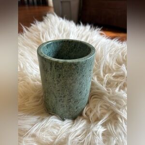 vintage marble vessel used as a wine bottle cooler, utensil holder, or vase.